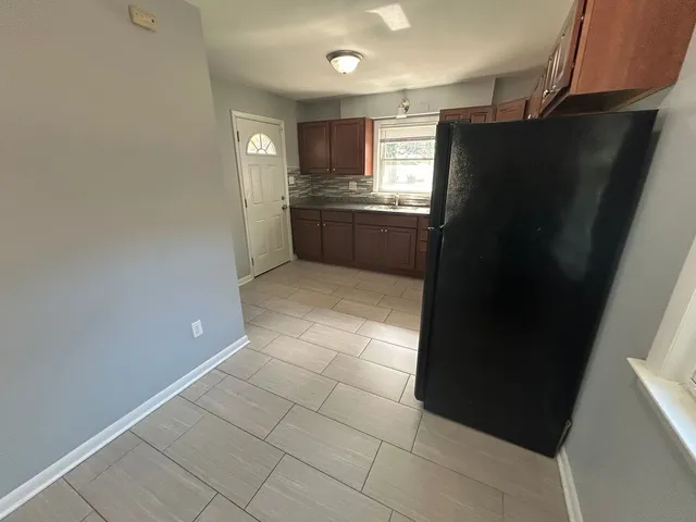 a kitchen with stainless steel appliances a refrigerator and a sink