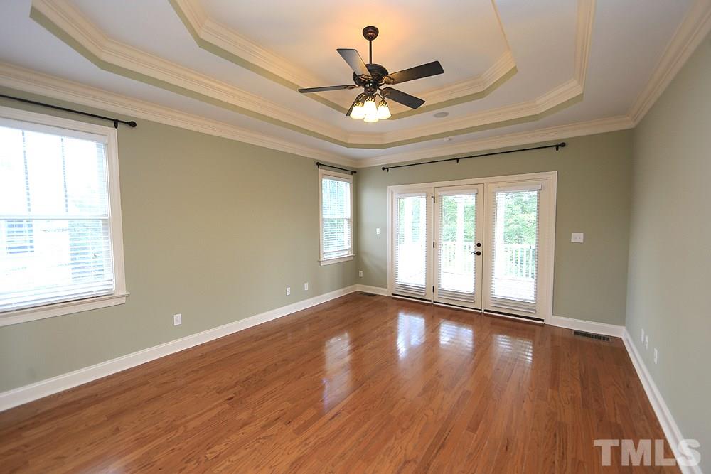 637 Competition Road Raleigh, NC 27603 - Photo 17 of 30 Just off the Great Room is the Spacious Master Suite that allows private access to the Screened in Porch. Well lit with natural light, the double trey ceiling is a great touch!