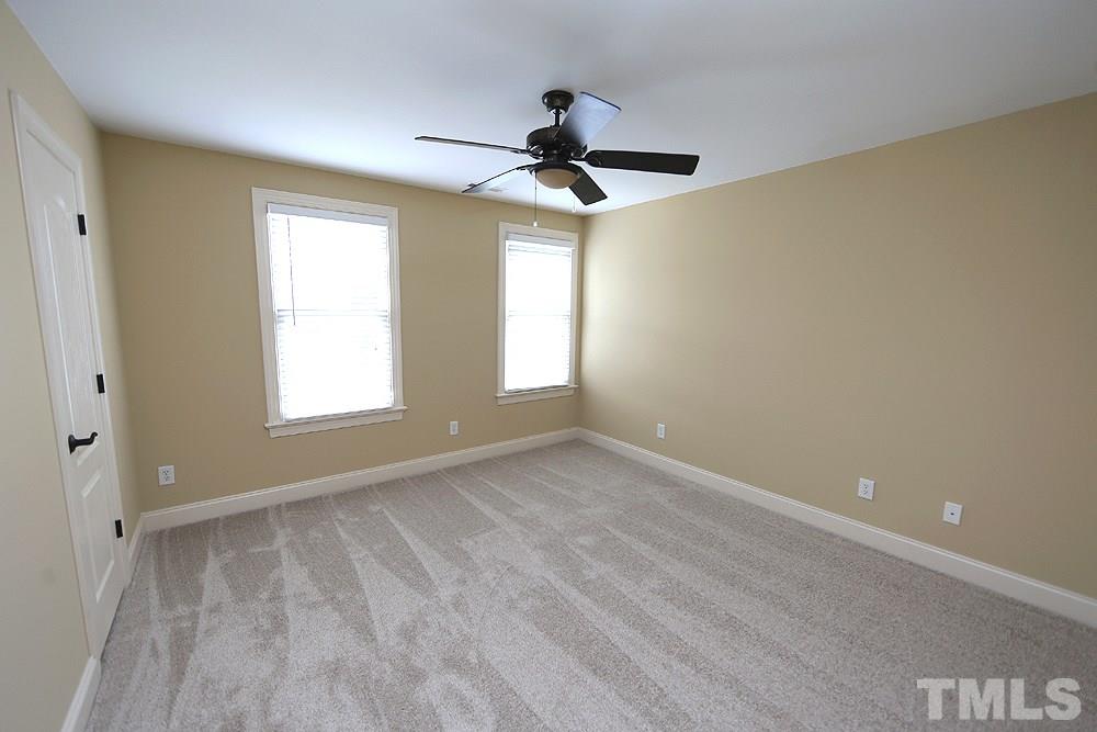637 Competition Road Raleigh, NC 27603 - Photo 22 of 30 As you come up the stairs this well sized bedroom will be the first door on your right.