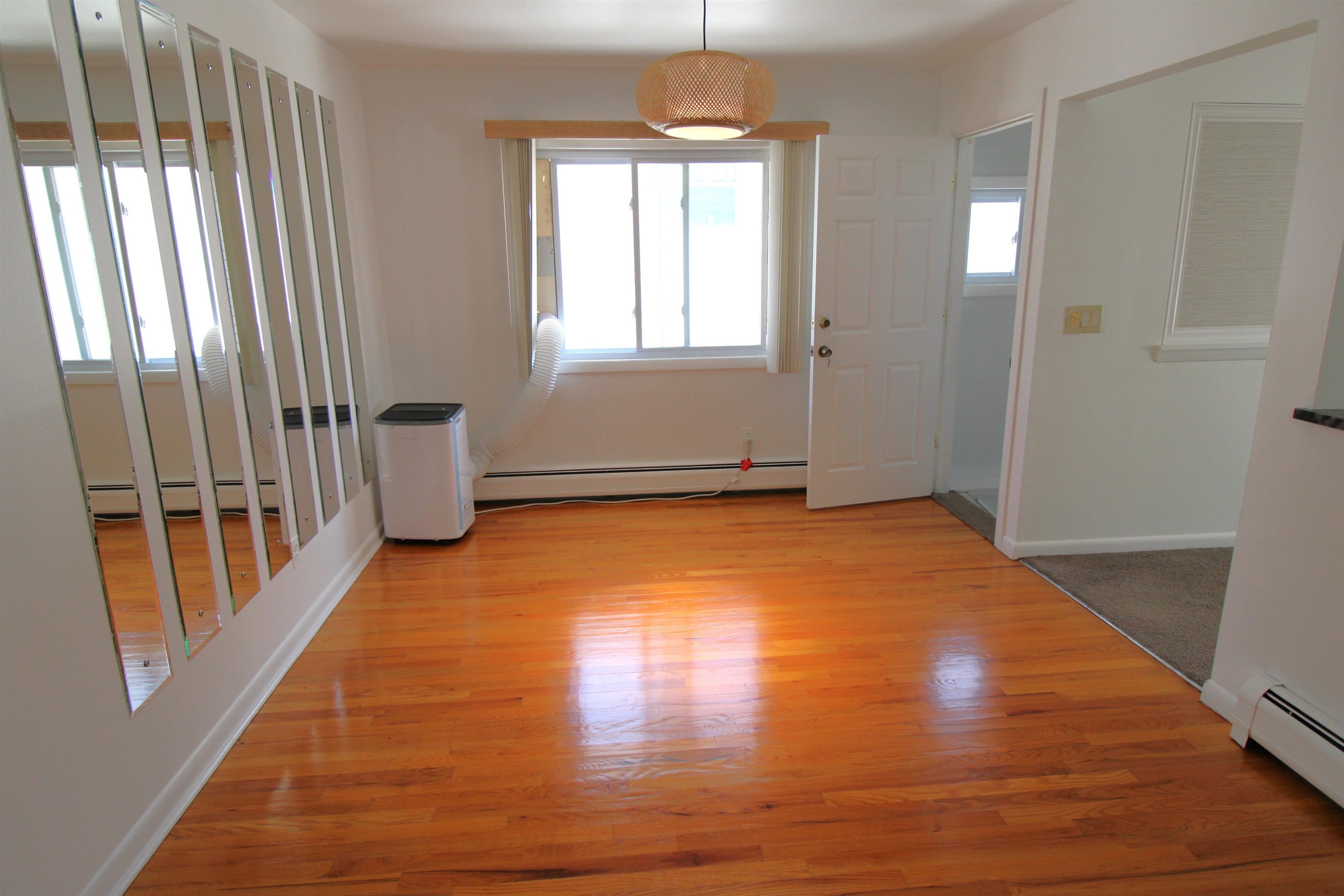 803 2nd Street, Unit 2 Secaucus, NJ 07094 - Photo 6 of 29 a view of empty room with wooden floor and fan