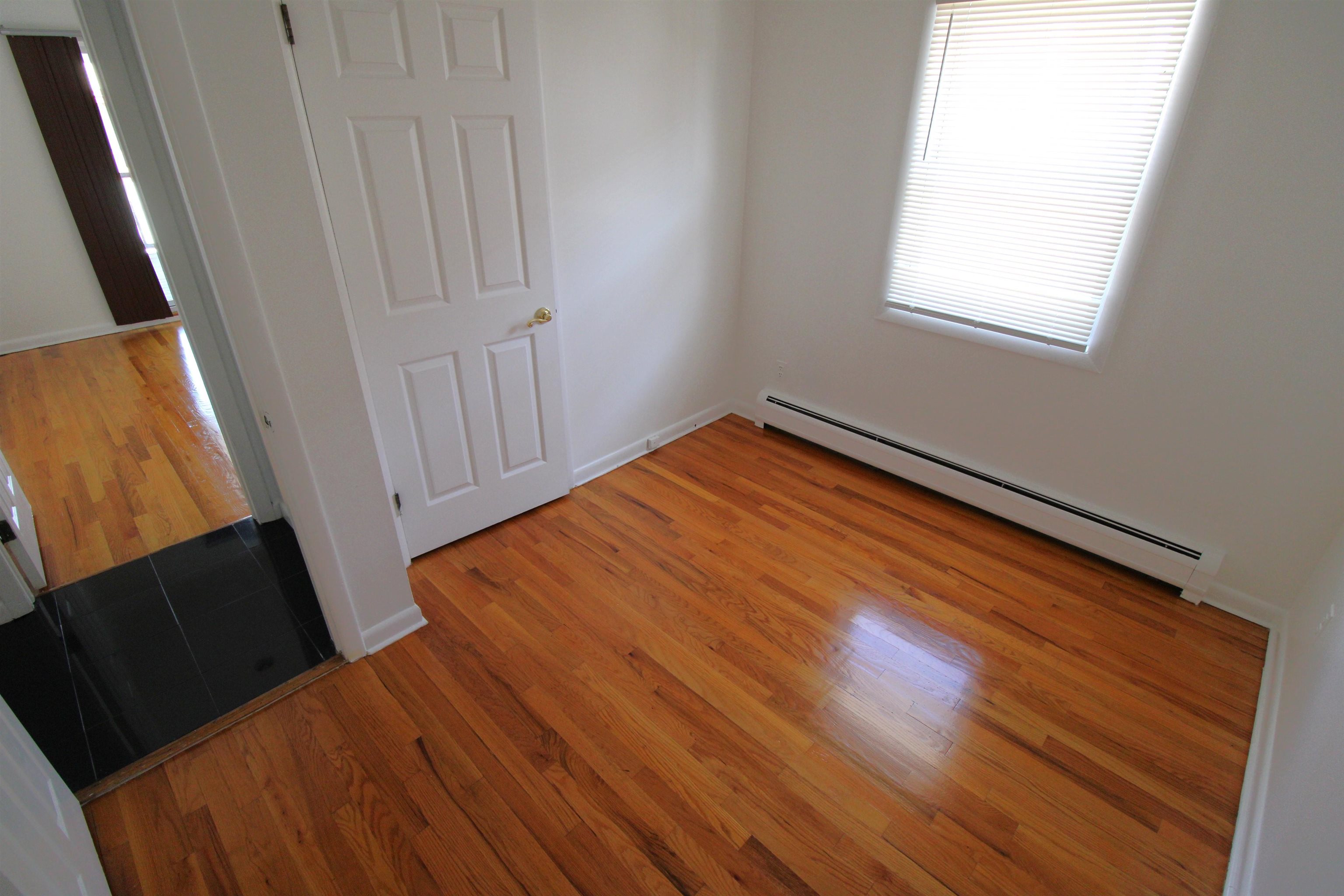 803 2nd Street, Unit 2 Secaucus, NJ 07094 - Photo 8 of 29 a view of a room with wooden floor and staircase