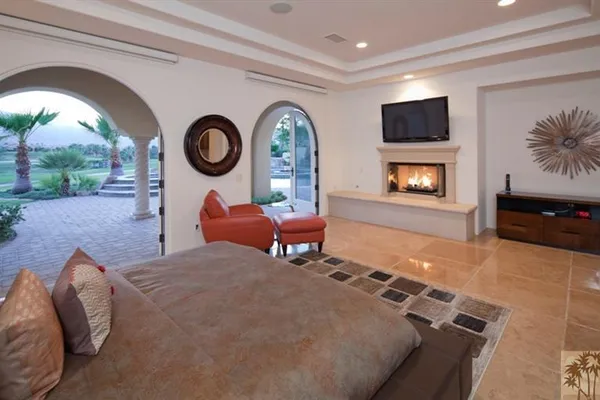 a large bathroom with a large tub sink and mirror