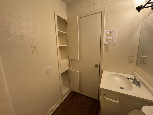 a bathroom with a sink and shower