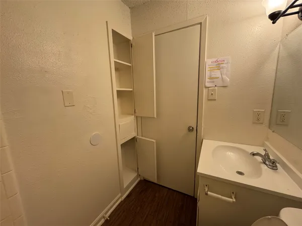 a bathroom with a sink and shower