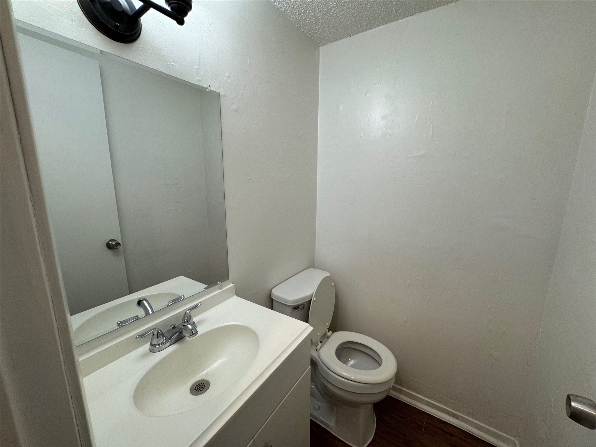 4904 West Wind Trail, Unit 103 Austin, TX 78745 - Photo 10 of 22 a bathroom with a sink and a toilet