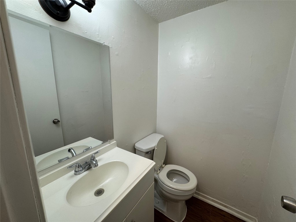 4904 West Wind Trail, Unit 103 Austin, TX 78745 - Photo 10 of 22 a bathroom with a sink and a toilet