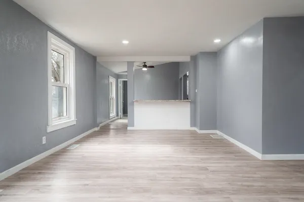 a view of a kitchen cabinets and wooden floor