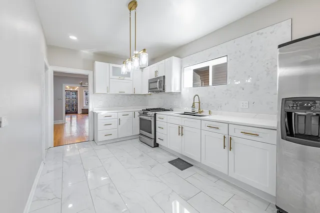 a kitchen with cabinets and window