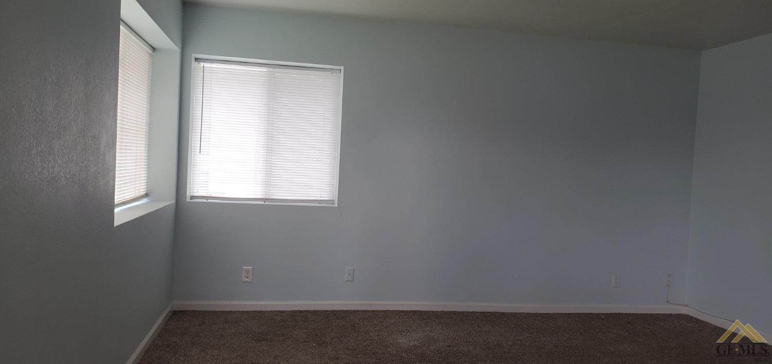 Undisclosed Address Wasco, CA 93280 - Photo 2 of 12 an empty room with a window
