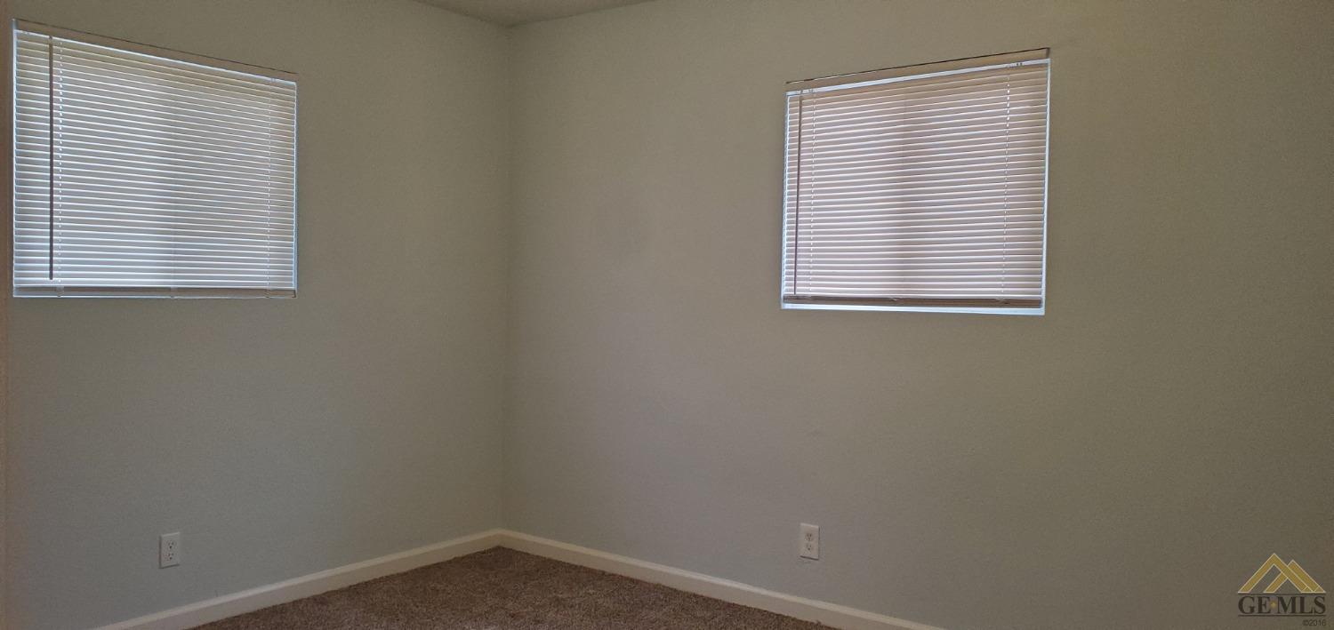 Undisclosed Address Wasco, CA 93280 - Photo 9 of 12 an empty room with a window