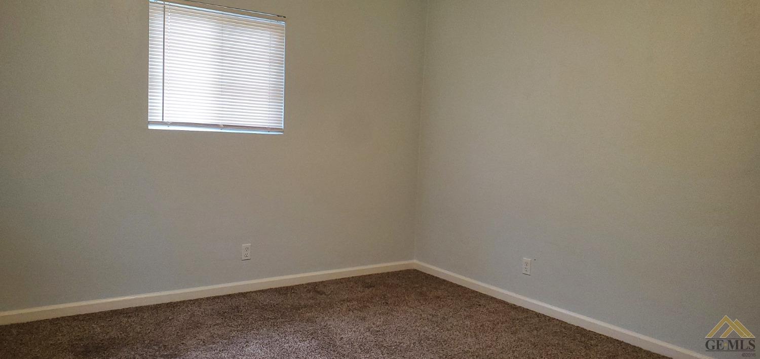 Undisclosed Address Wasco, CA 93280 - Photo 10 of 12 an empty room with a window