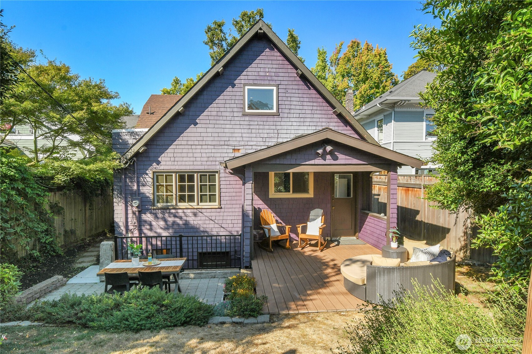 916 20th Avenue East Seattle, WA 98112 - Photo 11 of 28 a front view of a house with a yard outdoor seating and garage