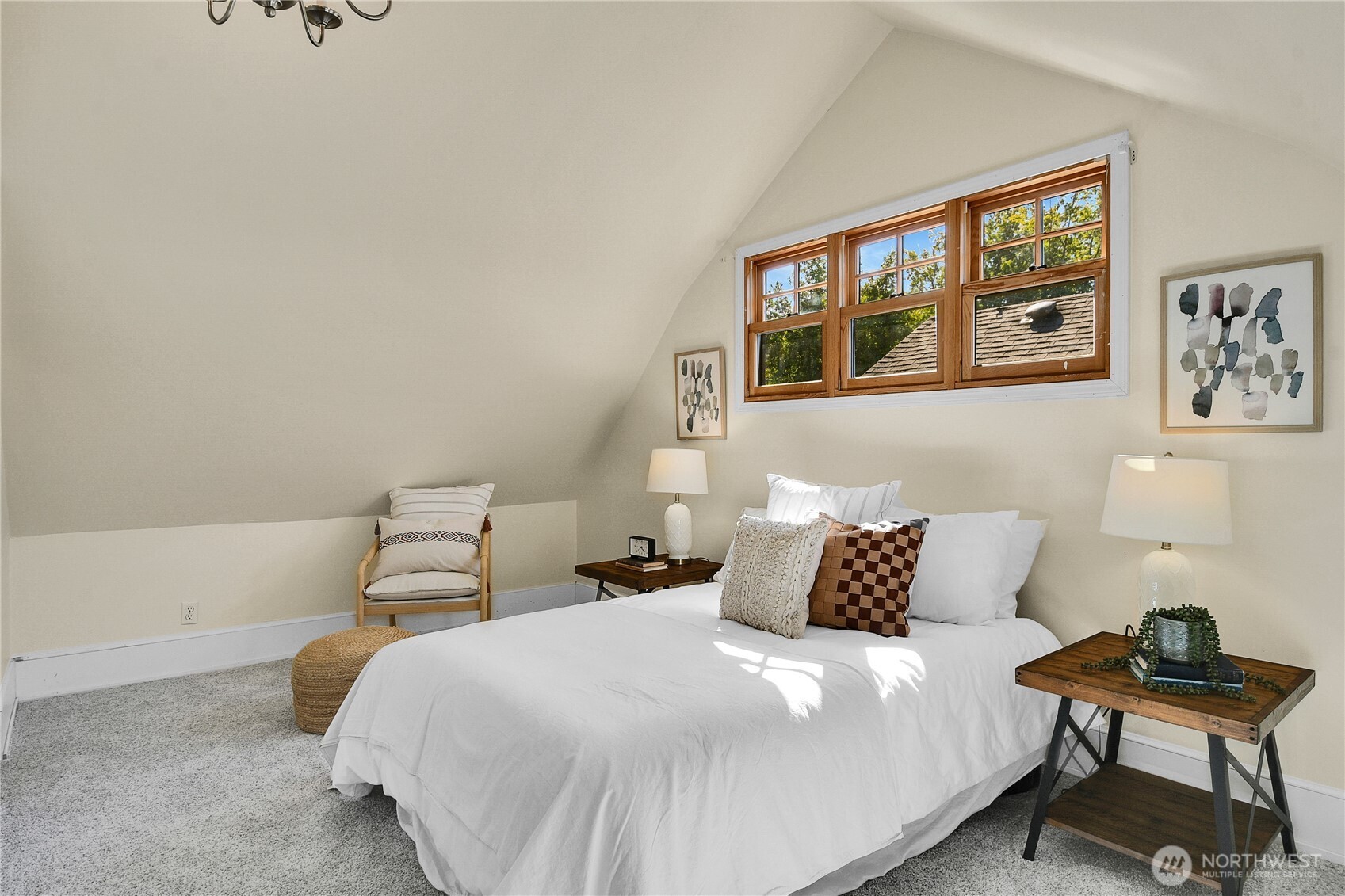 916 20th Avenue East Seattle, WA 98112 - Photo 18 of 28 a bedroom with a bed and wooden floor