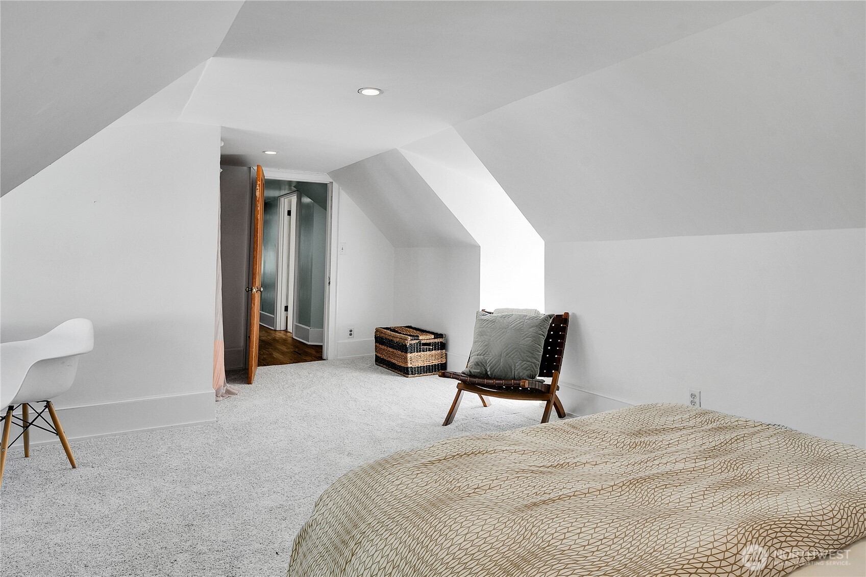 916 20th Avenue East Seattle, WA 98112 - Photo 20 of 28 a bedroom with a bed and chair