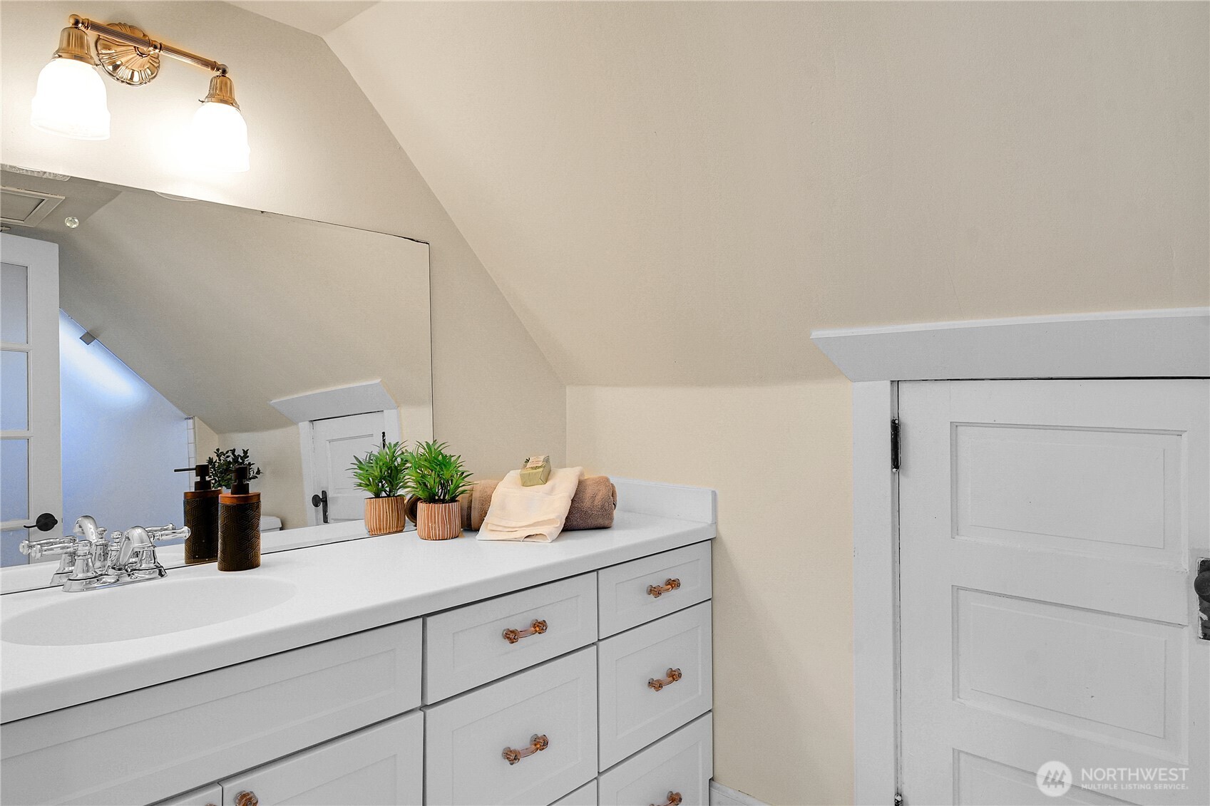 916 20th Avenue East Seattle, WA 98112 - Photo 21 of 28 a bathroom with a sink and a mirror