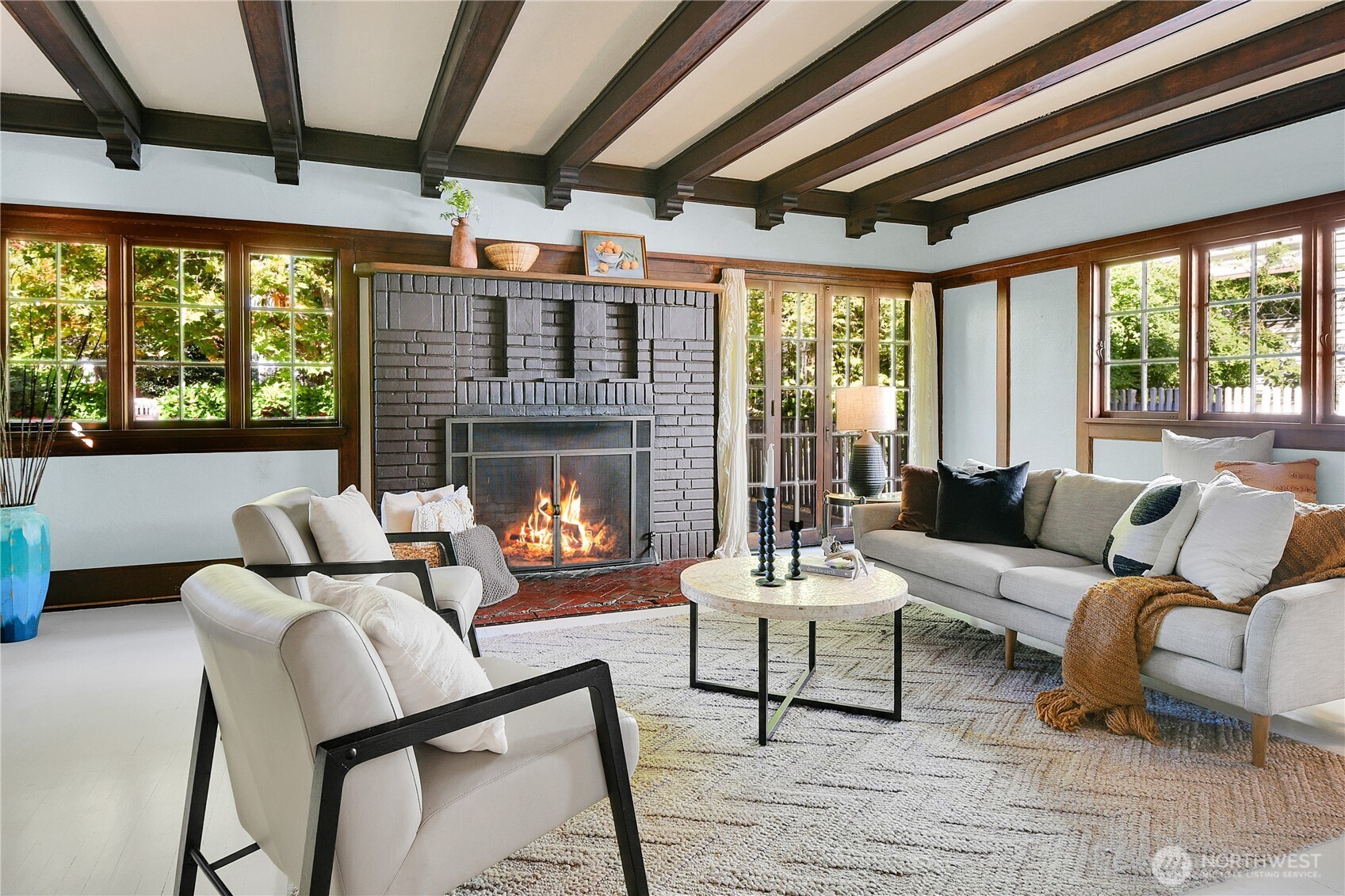 916 20th Avenue East Seattle, WA 98112 - Photo 3 of 28 a living room with furniture and a fireplace