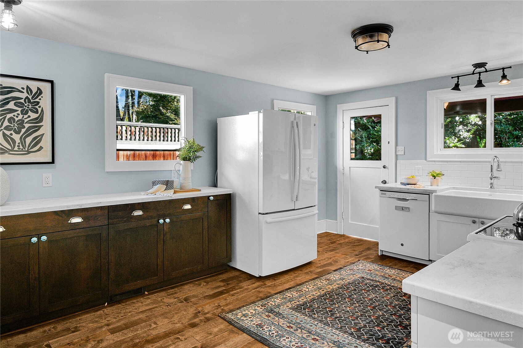 916 20th Avenue East Seattle, WA 98112 - Photo 9 of 28 a kitchen with a refrigerator and a sink