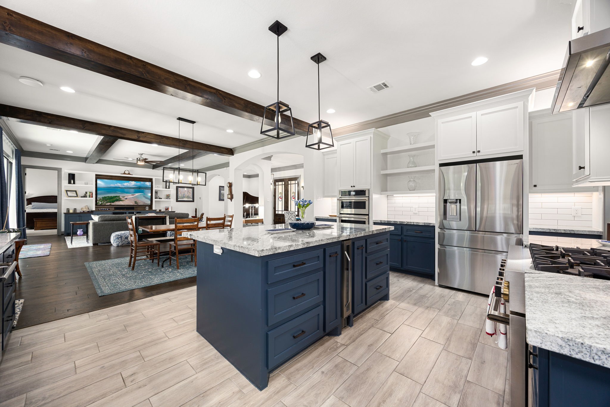 86 Dawns Edge Conroe, TX 77356 - Photo 13 of 50 a kitchen with stainless steel appliances granite countertop a refrigerator a sink dishwasher a oven and a refrigerator with wooden floor