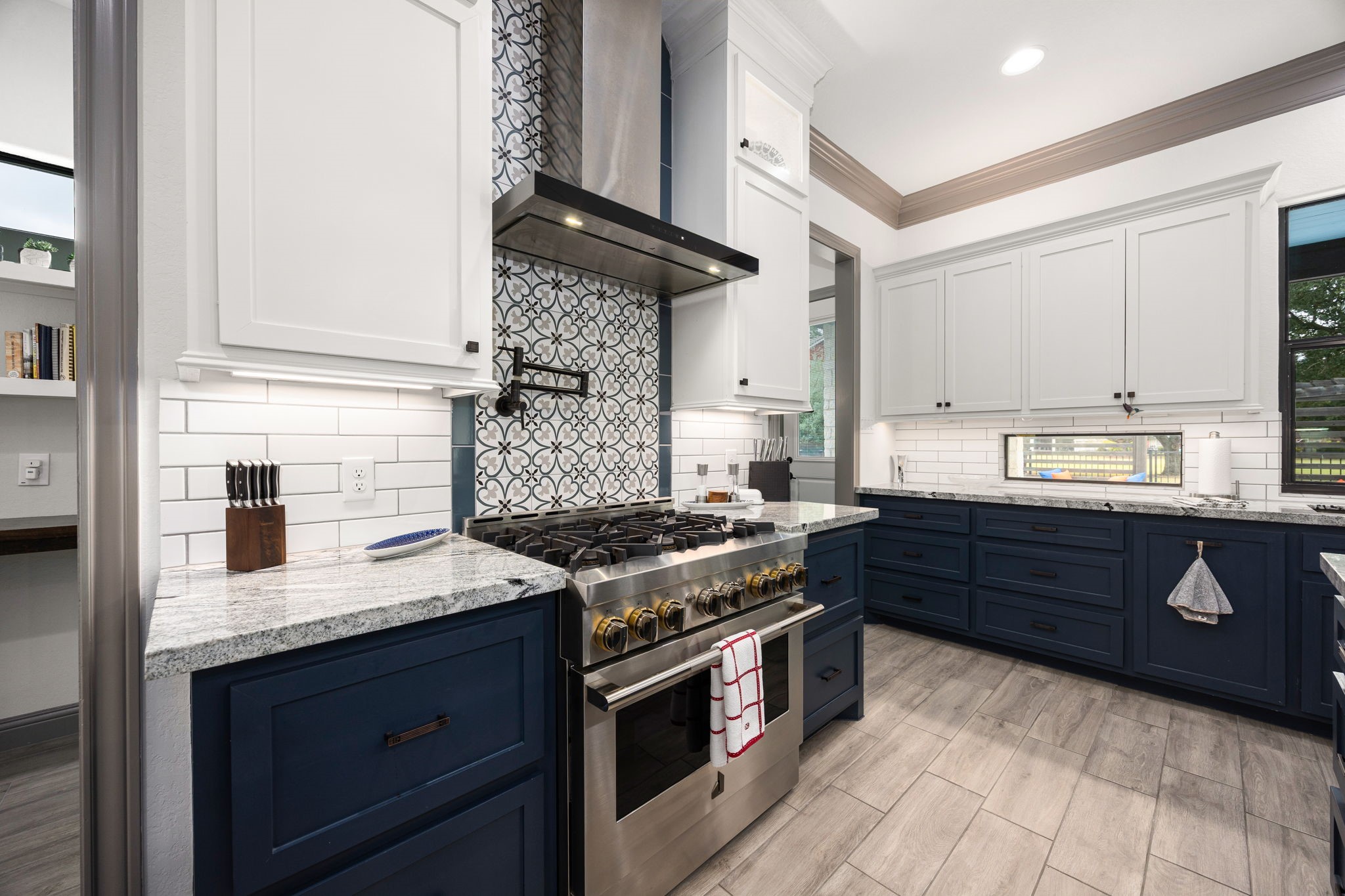 86 Dawns Edge Conroe, TX 77356 - Photo 14 of 50 a kitchen with granite countertop stainless steel appliances and wooden cabinets