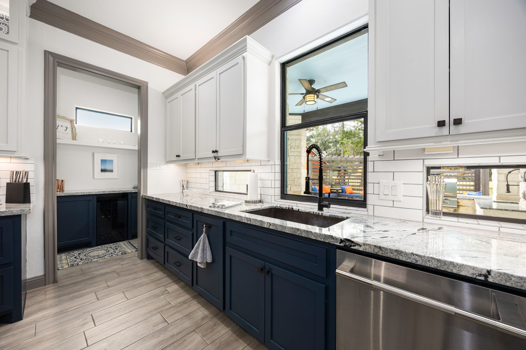 86 Dawns Edge Conroe, TX 77356 - Photo 15 of 50 a kitchen with stainless steel appliances granite countertop a sink a stove and cabinets