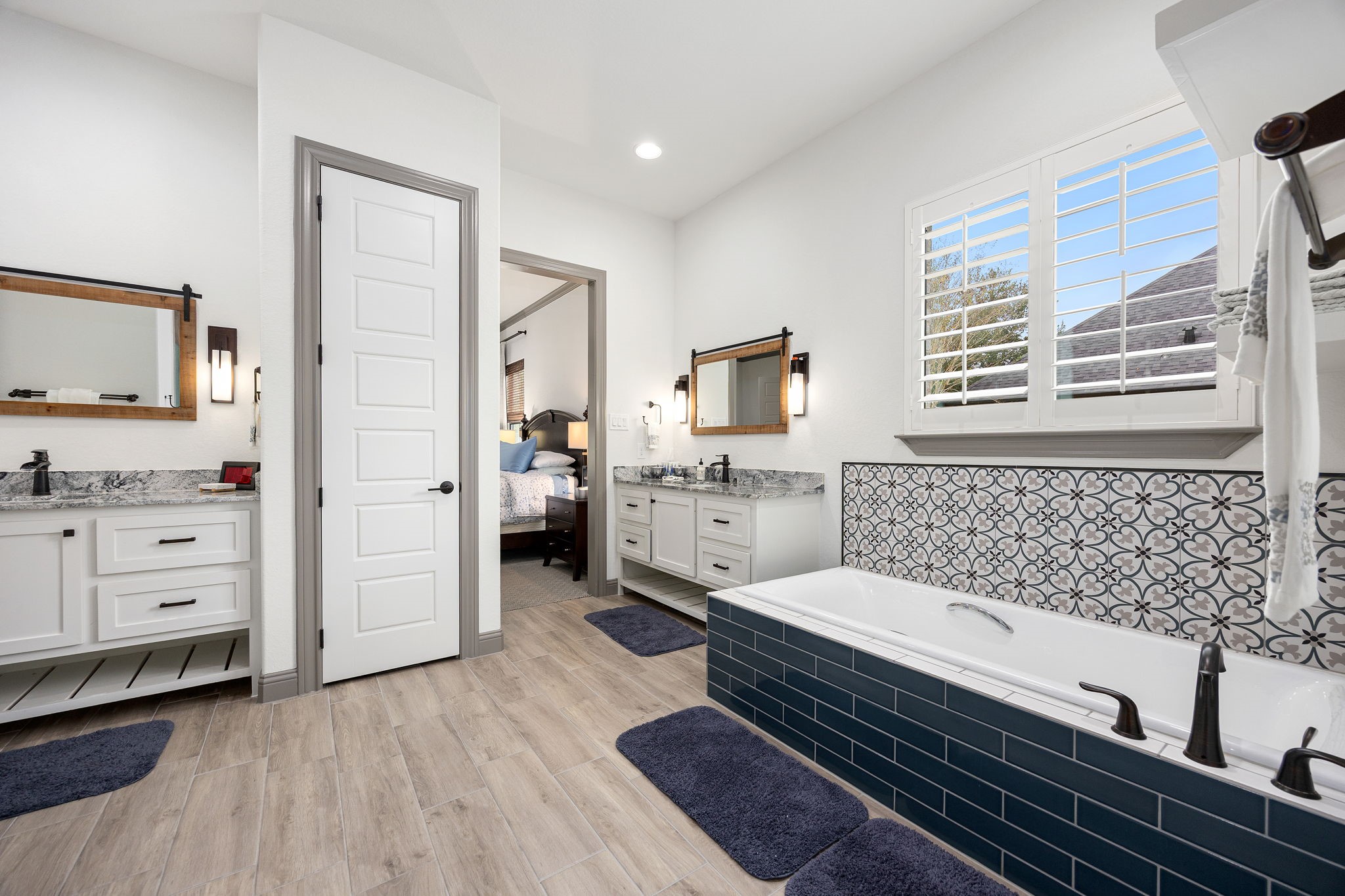 86 Dawns Edge Conroe, TX 77356 - Photo 19 of 50 Primary bathroom with dual vanity sinks, separate soaking tub and shower.