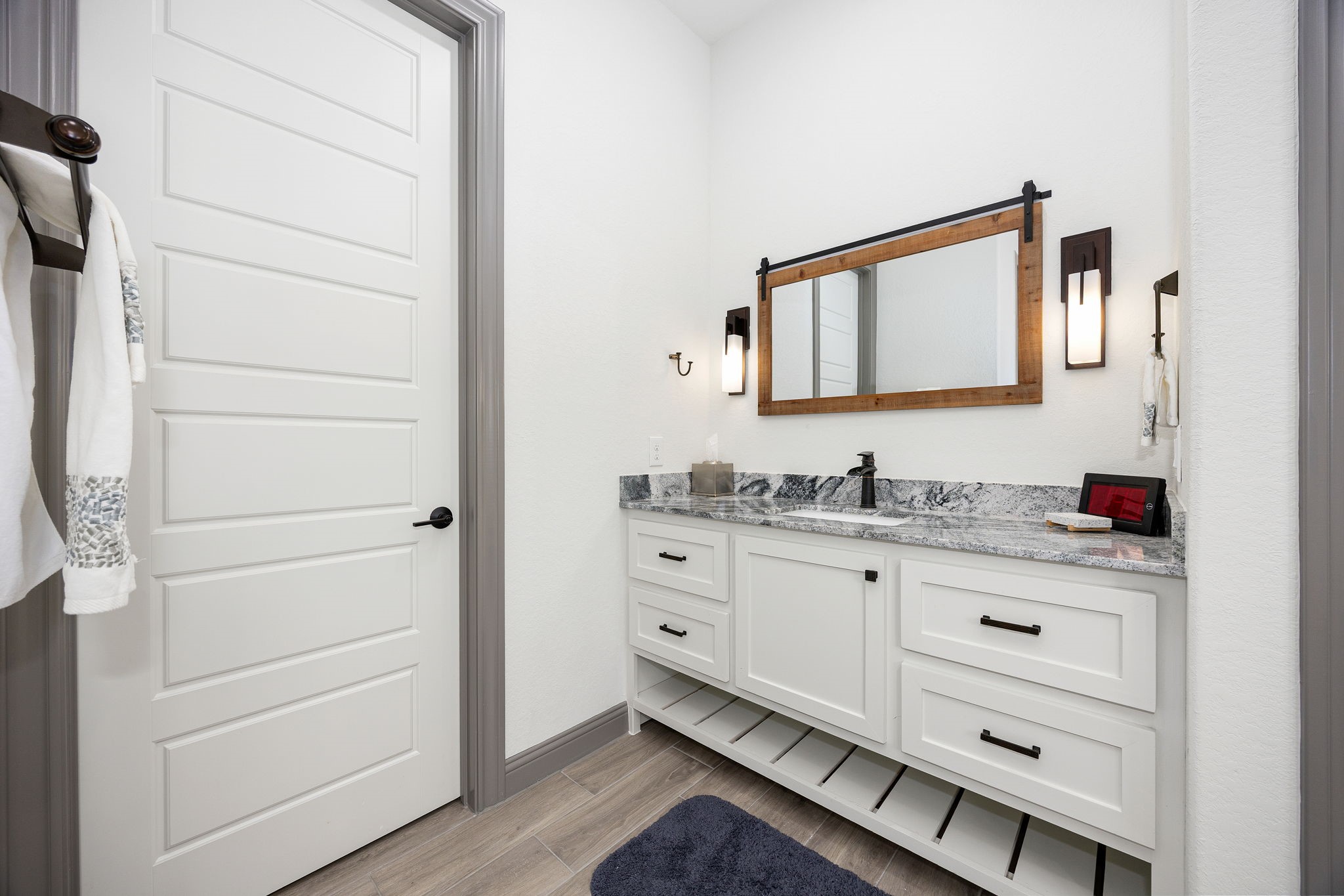 86 Dawns Edge Conroe, TX 77356 - Photo 20 of 50 a bathroom with a sink a vanity and a mirror
