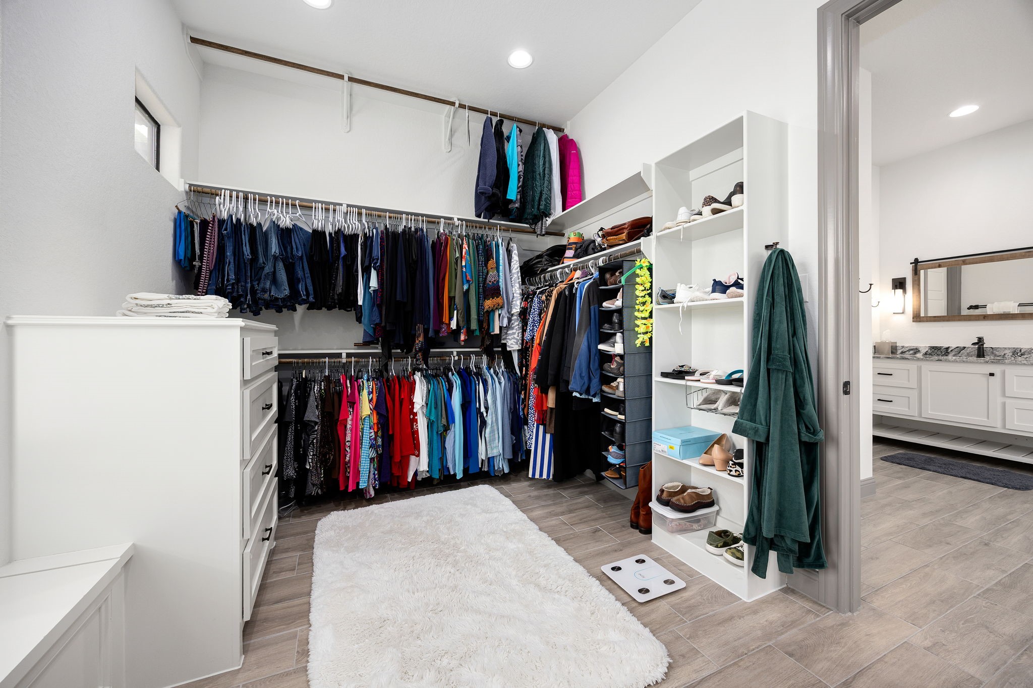 86 Dawns Edge Conroe, TX 77356 - Photo 22 of 50 a view of walk in closet with clothes and shoes