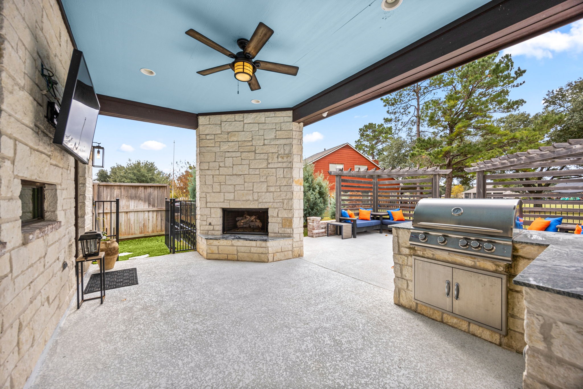 86 Dawns Edge Conroe, TX 77356 - Photo 34 of 50 a living room with furniture a fireplace and a floor to ceiling window