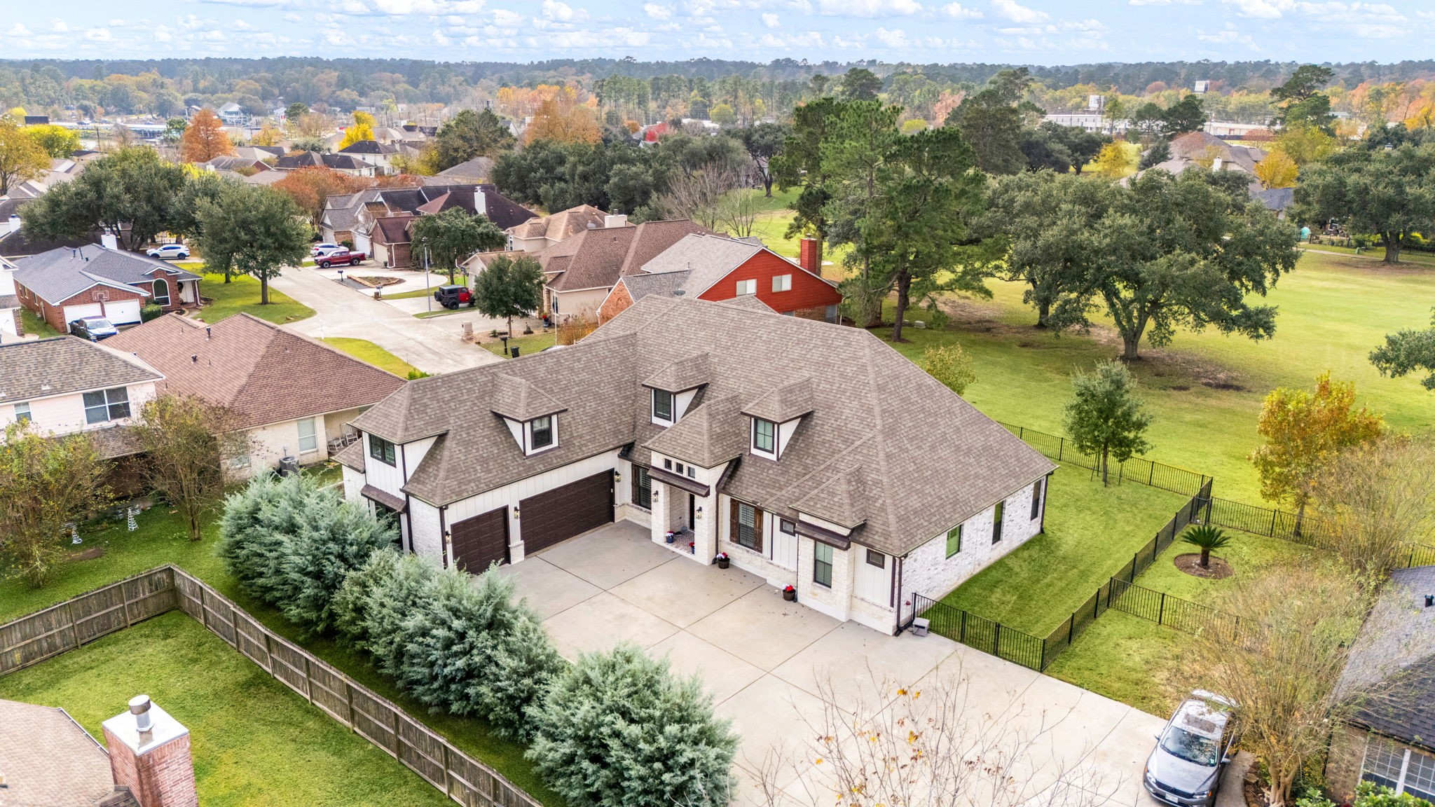 86 Dawns Edge Conroe, TX 77356 - Photo 39 of 50 an aerial view of a house with a garden and lake view