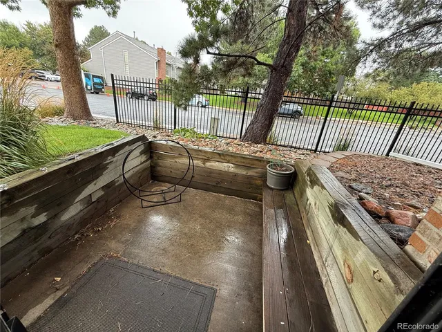 a view of backyard with deck and wooden floor