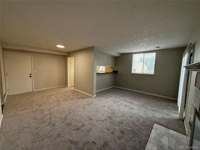 a view of an empty room and window