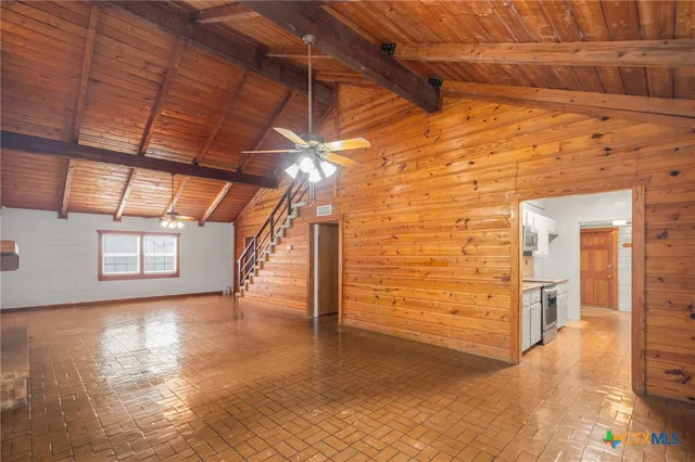 a view of a room with wooden walls