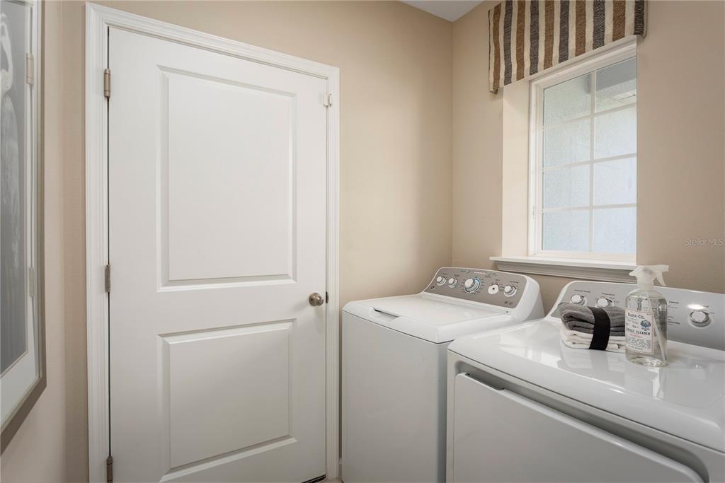 2313 Scenic Pk Loop Wimauma, FL 33598 - Photo 19 of 19 a utility room with dryer and washer