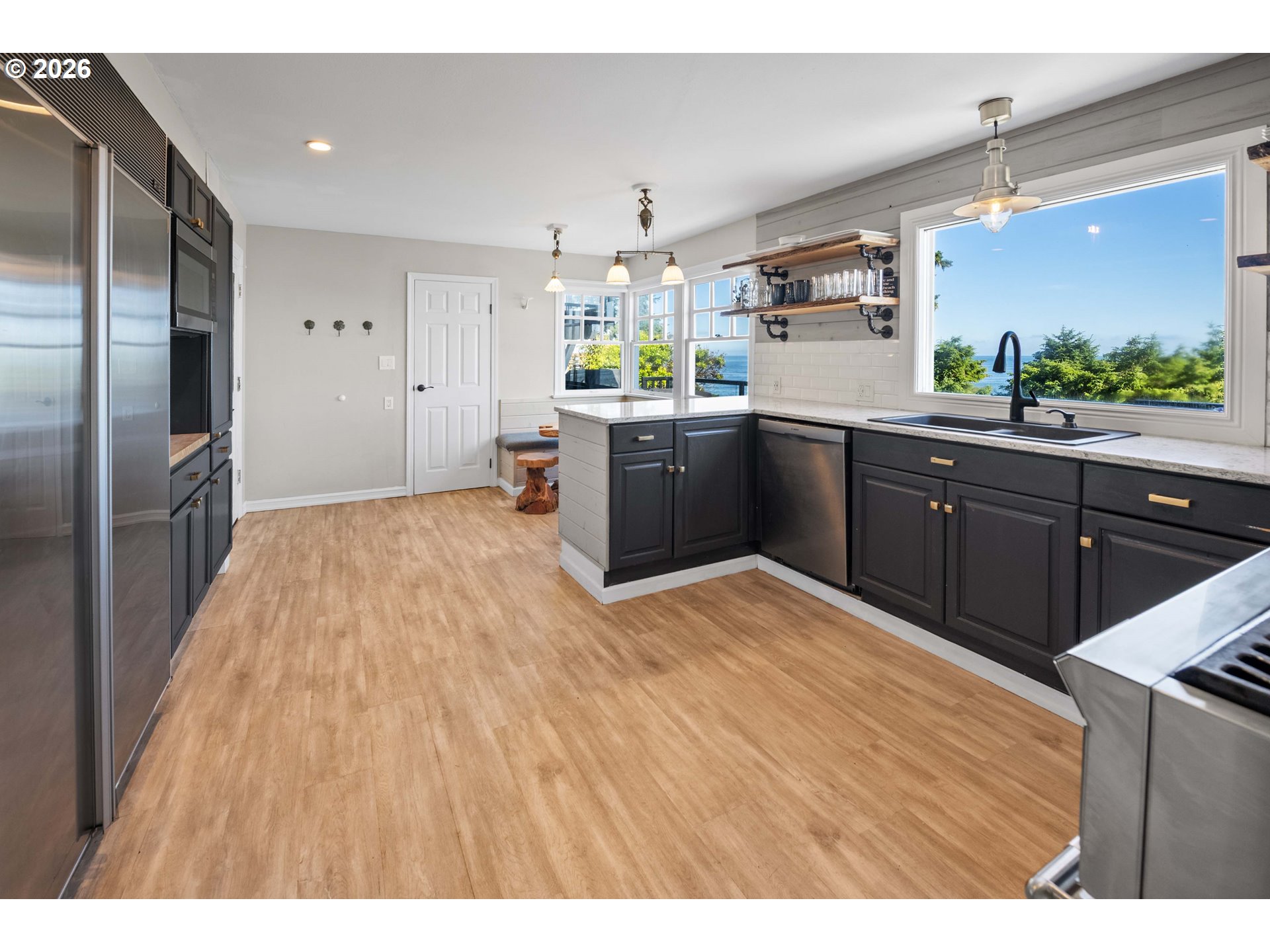 3232 Sunset Boulevard Seaside, OR 97138 - Photo 8 of 48 a large kitchen with a sink and refrigerator