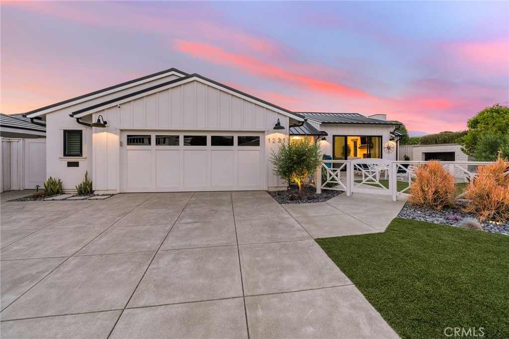 1231 Sand Key Corona del Mar, CA 92625 - Photo 16 of 65 a front view of a house with a yard