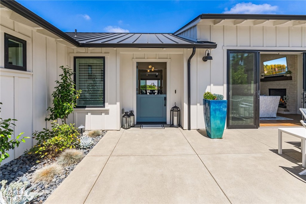 1231 Sand Key Corona del Mar, CA 92625 - Photo 22 of 65 a front view of a house with potted plants