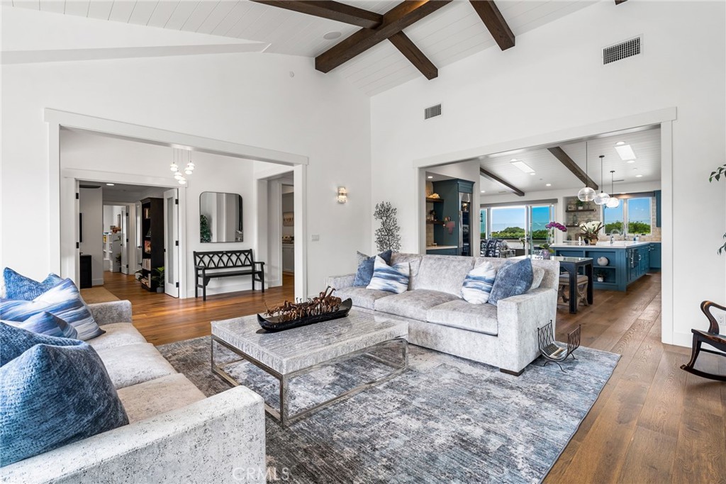 1231 Sand Key Corona del Mar, CA 92625 - Photo 26 of 65 a living room with furniture and a wooden floor