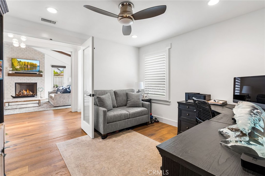 1231 Sand Key Corona del Mar, CA 92625 - Photo 27 of 65 a living room with furniture and a fireplace