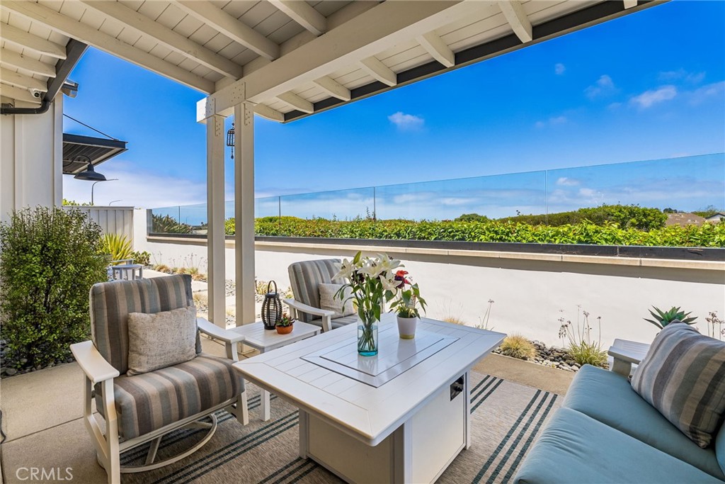 1231 Sand Key Corona del Mar, CA 92625 - Photo 39 of 65 a view of balcony with couch and outdoor view
