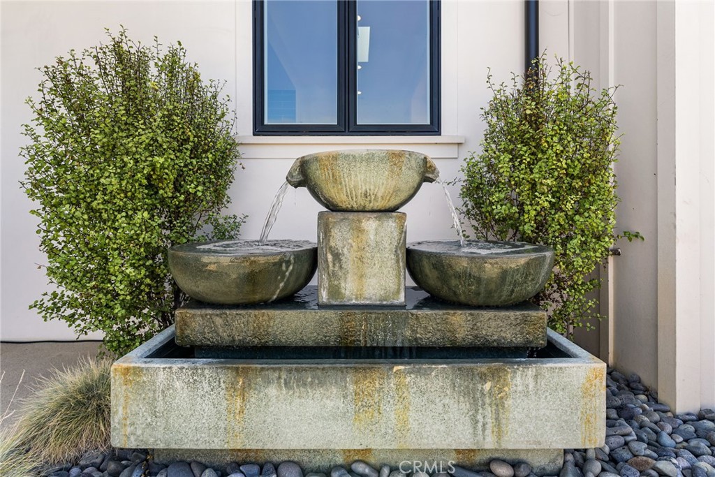 1231 Sand Key Corona del Mar, CA 92625 - Photo 46 of 65 a view of a fountain in the backyard of a house