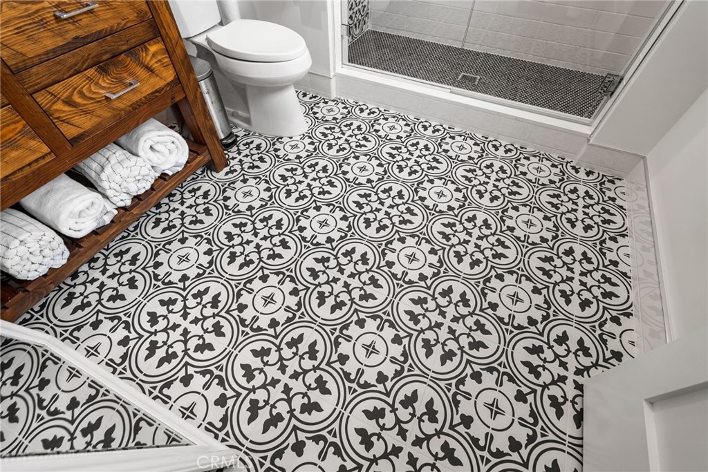 1231 Sand Key Corona del Mar, CA 92625 - Photo 51 of 65 a bathroom with a toilet and a shower curtain