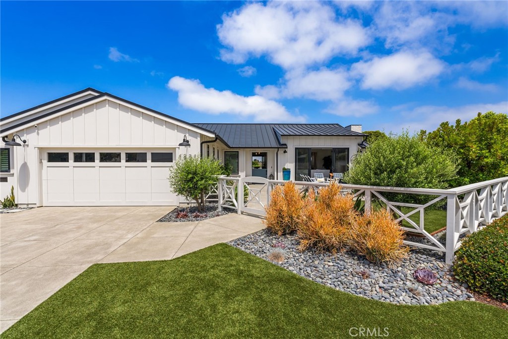 1231 Sand Key Corona del Mar, CA 92625 - Photo 54 of 65 front view of a house with a yard
