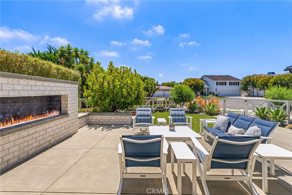 1231 Sand Key Corona del Mar, CA 92625 - Photo 57 of 65 a outdoor living space with furniture and a fireplace