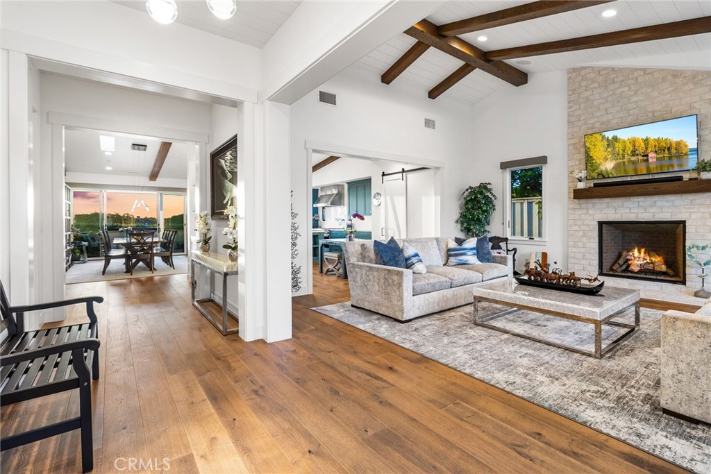 1231 Sand Key Corona del Mar, CA 92625 - Photo 8 of 65 a living room with furniture and a fireplace