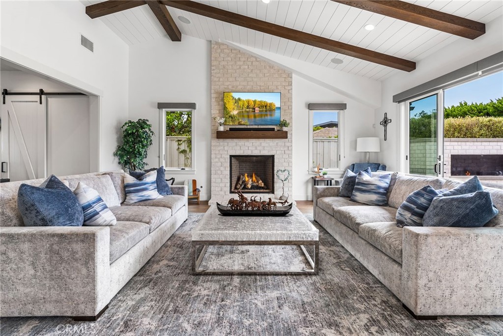 1231 Sand Key Corona del Mar, CA 92625 - Photo 9 of 65 a living room with furniture and a fireplace