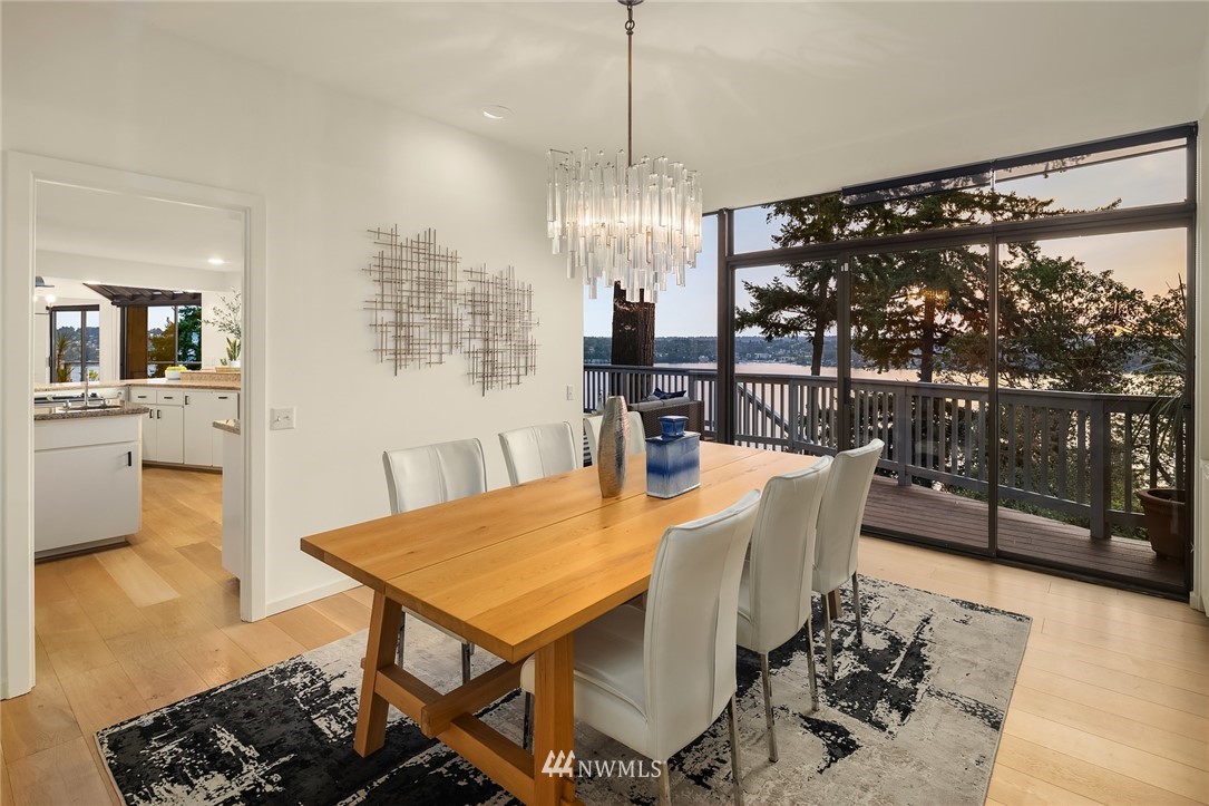 7701 Ridgecrest Lane Mercer Island, WA 98040 - Photo 11 of 35 a view of a dining room with furniture window and wooden floor