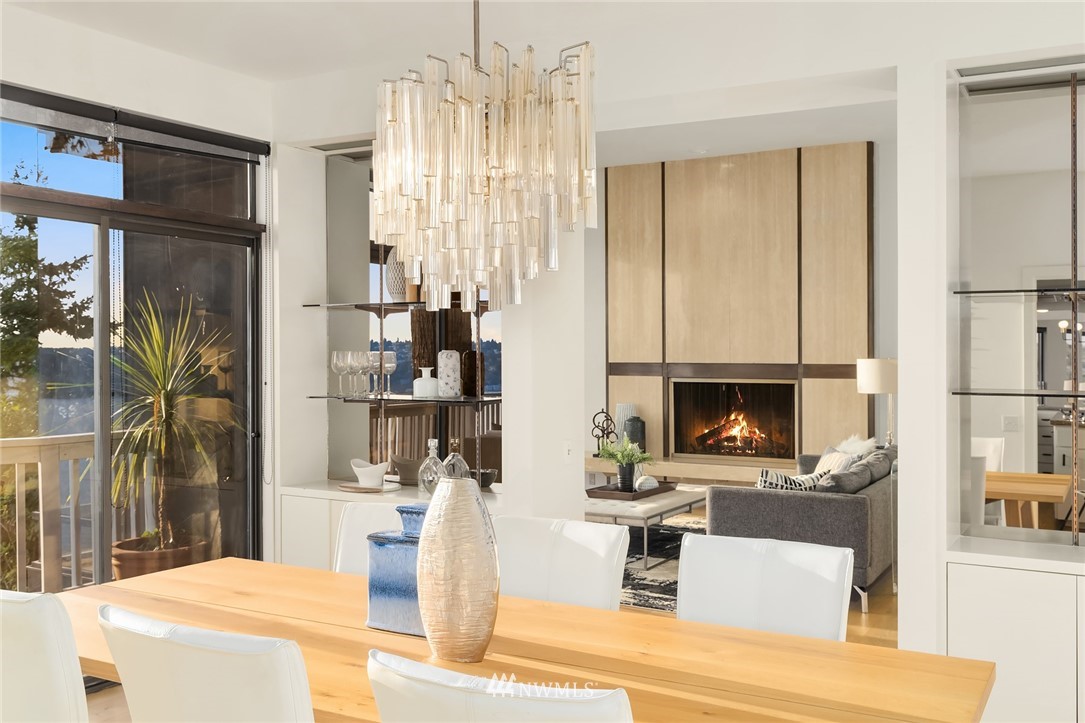 7701 Ridgecrest Lane Mercer Island, WA 98040 - Photo 12 of 35 a living room with fireplace furniture and a flat screen tv