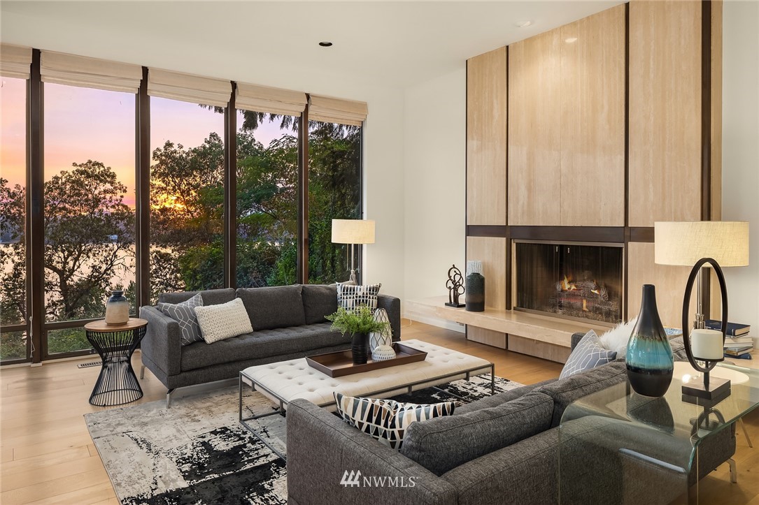 7701 Ridgecrest Lane Mercer Island, WA 98040 - Photo 13 of 35 a living room with furniture and a large window