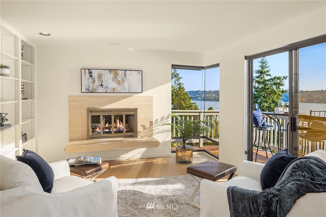 7701 Ridgecrest Lane Mercer Island, WA 98040 - Photo 19 of 35 a living room with furniture and a floor to ceiling window