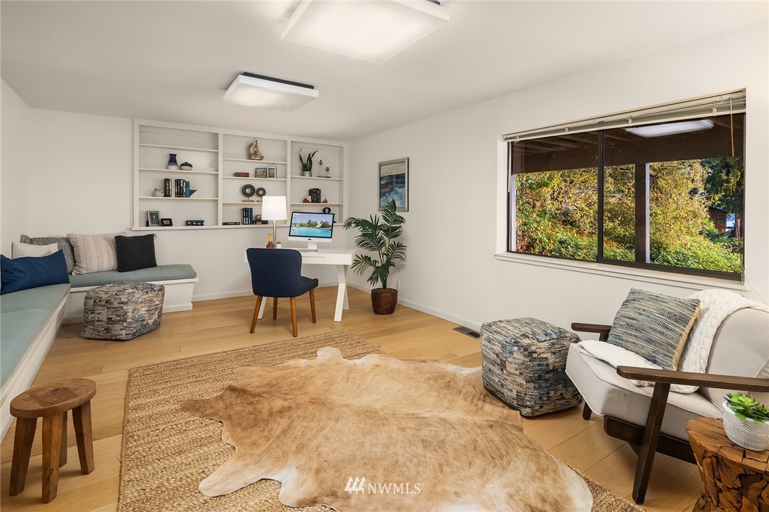 7701 Ridgecrest Lane Mercer Island, WA 98040 - Photo 27 of 35 a living room with furniture and a window